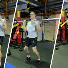 Man training to increase punch strength with dumbbells, barbell, and medicine ball in a gym.