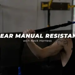 Man using a neck harness for linear manual resistance training, working neck muscles.