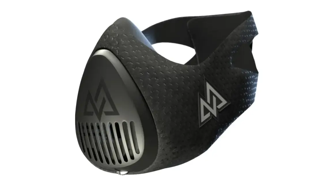 A black high elevation mask with a textured surface and a silver logo. It features a vented front and adjustable straps.