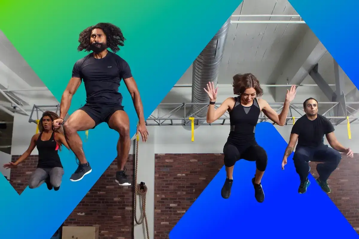 Four people jump in a gym, showcasing the physical endurance needed for intense workouts.