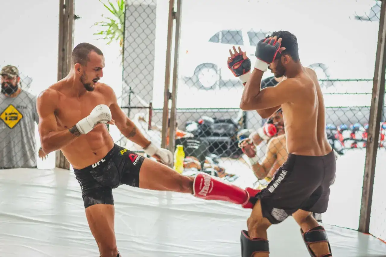 Two fighters spar in a ring, showcasing the intense boxing psychology of anticipating moves and reacting with precision.